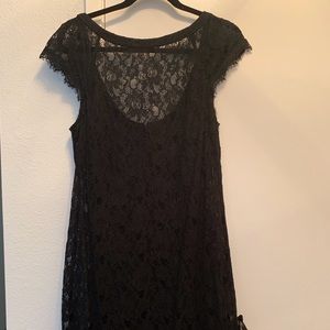 Lacy black dress with feather detail.